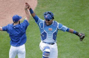Kansas City Royals' Salvador Perez, right, celebrates with a teammate after a baseball game against the Texas Rangers, Sunday, June 7, 2015, in Kansas City, Mo. The Royals won 4-3. (AP Photo/Charlie Riedel)