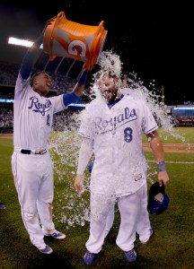 Kansas City Royals' Salvador Perez (13) dunks Mike Moustakas (8) after their baseball game against the Pittsburgh Pirates Wednesday, July 22, 2015, in Kansas City, Mo. The Royals won 5-1. (AP Photo/Charlie Riedel)