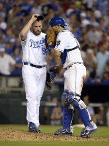 Aug 14, 2015; Kansas City, MO, USA; Kansas City Royals catcher Drew Butera (9) talks to relief pitcher Greg Holland (56) in the ninth inning against the Los Angeles Angels at Kauffman Stadium. Kansas City won the game 4-1. Mandatory Credit: John Rieger-USA TODAY Sports