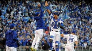 KANSAS CITY, MO - OCTOBER 09:  Salvador Perez #13 and Tim Collins of the Kansas City Royals celebrate after defeating the Houston Astros in game two of the American League Division Series at Kauffman Stadium on October 9, 2015 in Kansas City, Missouri.  The Royals defeated the Astros with a score of 5 to 4.  (Photo by Ed Zurga/Getty Images)