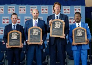 Newly-inducted National Baseball Hall of Famers from left to right, Craig Biggio, John Smoltz, Randy Johnson and Pedro Martinez hold their plaques after an induction ceremony at the Clark Sports Center on Sunday, July 26, 2015, in Cooperstown, N.Y. (AP Photo/Mike Groll)